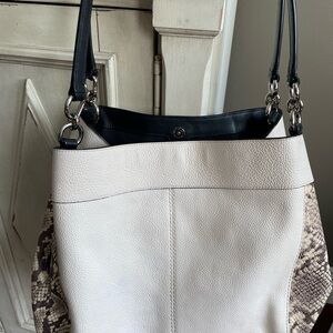 Beautiful Coach Handbag very gently pre owned. White with snake design on sides